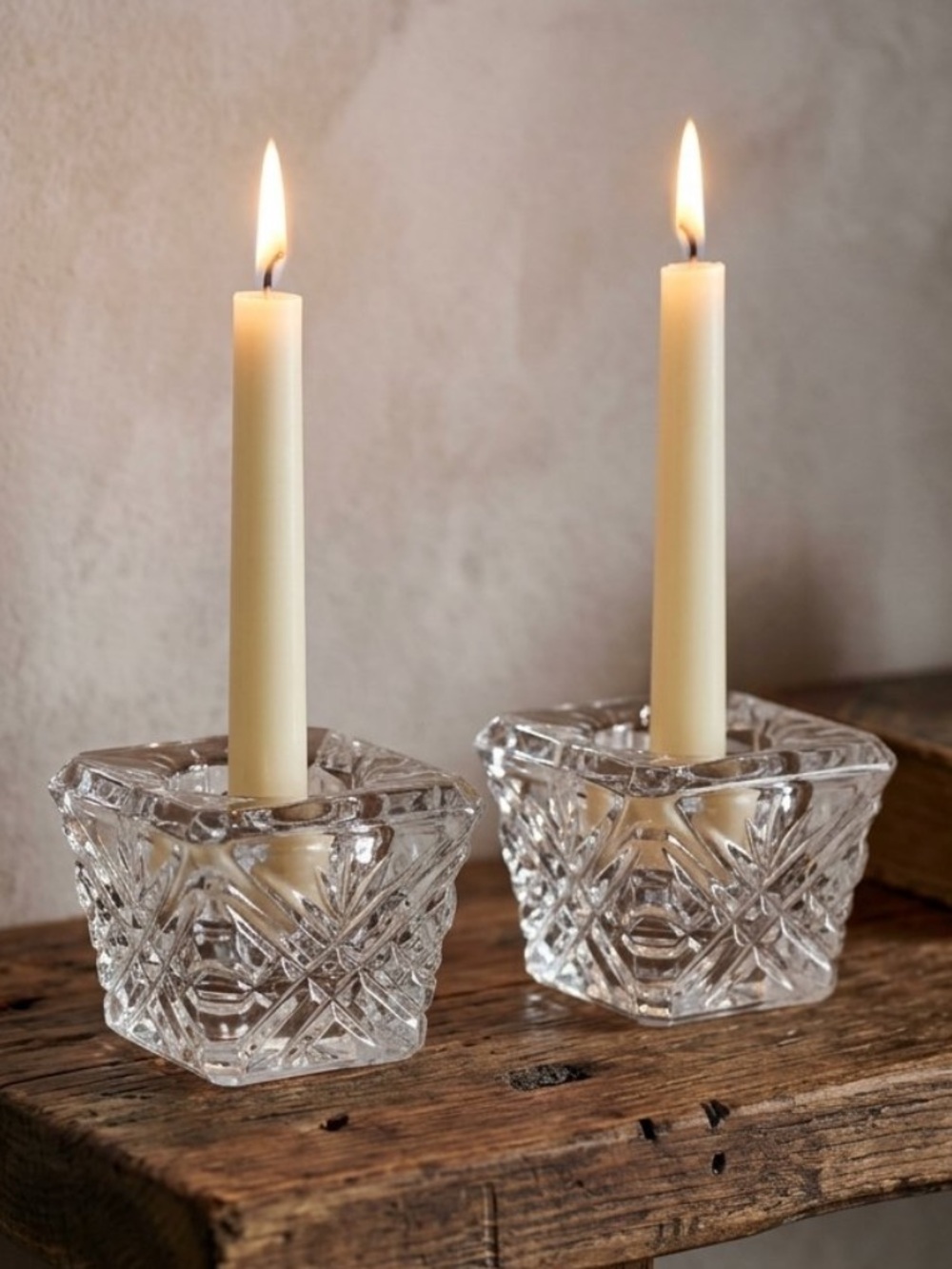 Discover a stunning pair of vintage cut glass taper candle holders